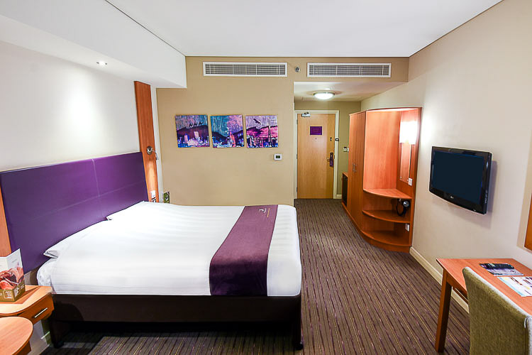 Double bedroom with televison and desk space at Premier Inn Dubai International Airport hotel