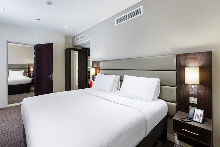 Double bedroom with interconnecting room to additional bedroom in Premier Inn hotel near Doha Airport