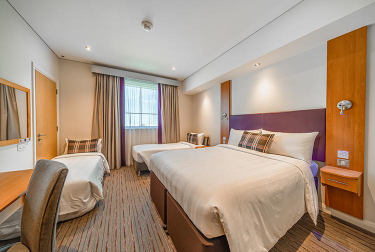 Family bedroom with double bed at Premier Inn Dubai Investments Park near Expo 2020