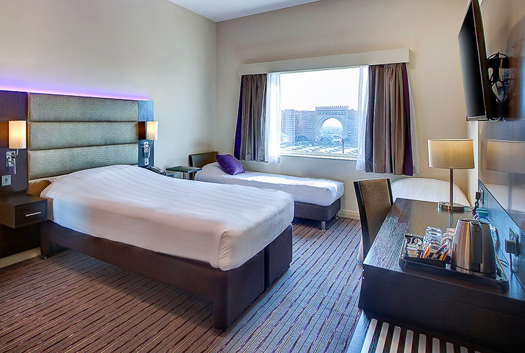 Family room with three beds and views of Ibn Battuta Gateat Premier Inn hotels