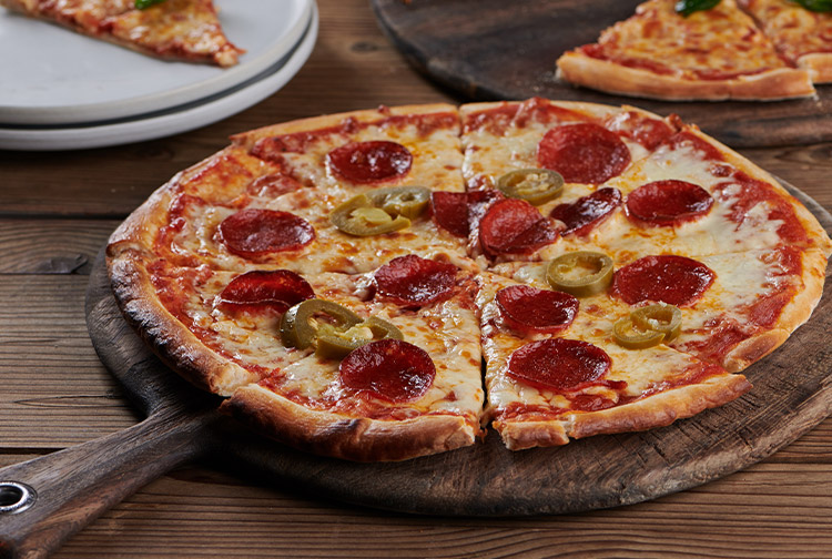 Pepperoni pizza sliced for diners at Premier Inn hotel in Dubai