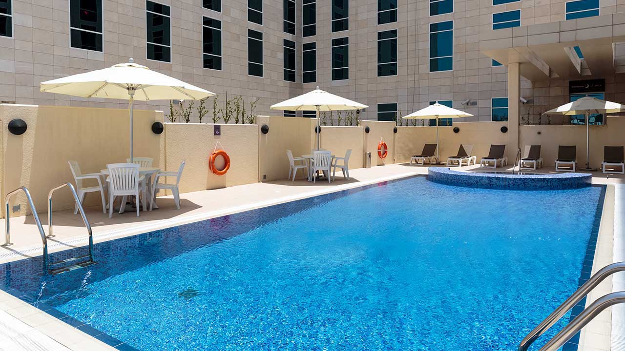 image of roof top swimming pool doha hotel