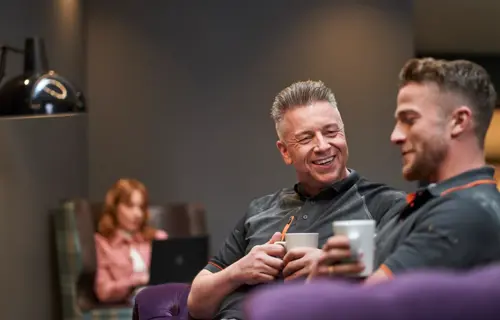 Two men having a coffee/tea break