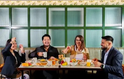 Group of people in Restaurant Pub Eating Breakfast